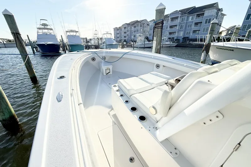 Slide: The Image of 2022 Onslow Bay 41 Tournament boat docked at marina with luxury seating. - 11