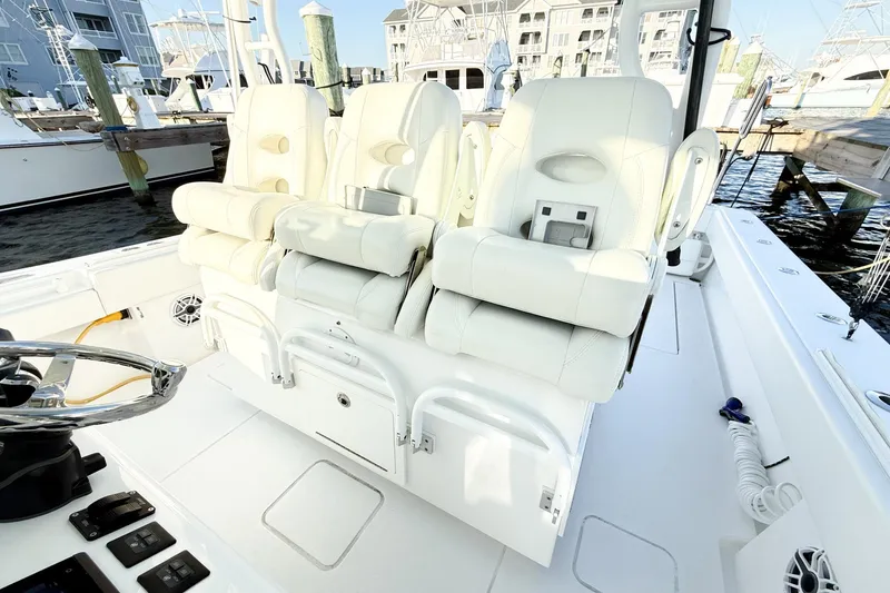Slide: The Image of Luxurious seating on a 2022 Onslow Bay 41 Tournament boat, docked at a marina. - 14