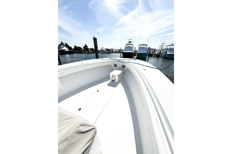 Slide: The Image of 2022 Onslow Bay 41 Tournament boat docked at marina under clear blue sky. - 17