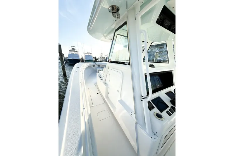 Slide: The Image of 2022 Onslow Bay 41 Tournament boat interior with sleek design and advanced controls. - 19