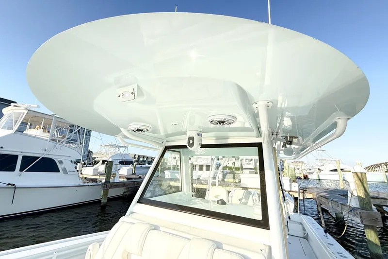 Slide: The Image of 2022 Onslow Bay 41 Tournament boat docked, showcasing sleek design and spacious deck. - 20