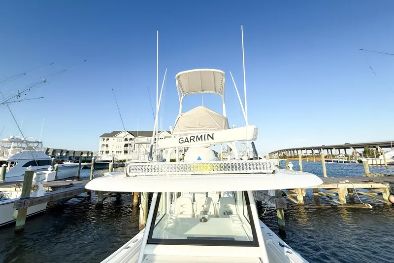 Slide: The Image of 2022 Onslow Bay 41 Tournament boat docked at marina under clear blue sky. - 21