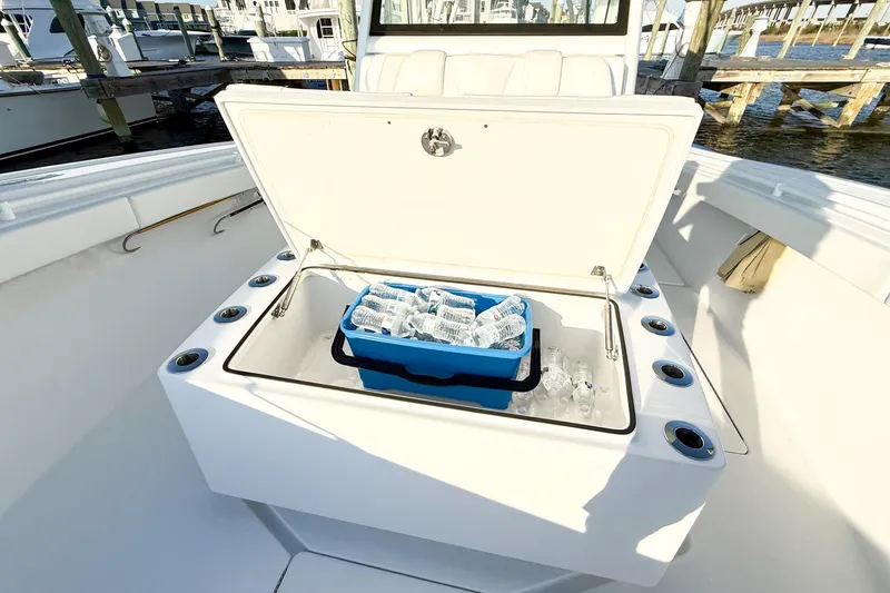 Slide: The Image of Onslow Bay 41 Tournament 2022 boat with open cooler filled with bottled water. - 22