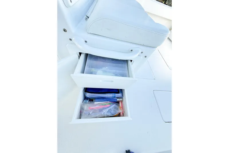 Slide: The Image of Storage drawers on a 2022 Onslow Bay 41 Tournament boat, containing fishing gear and supplies. - 23