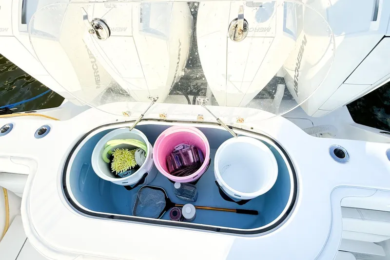 Slide: The Image of 2022 Onslow Bay 41 Tournament boat with storage compartment and buckets on deck. - 24