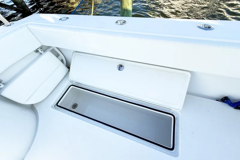 Slide: The Image of 2022 Onslow Bay 41 Tournament boat deck with open storage compartment. - 25