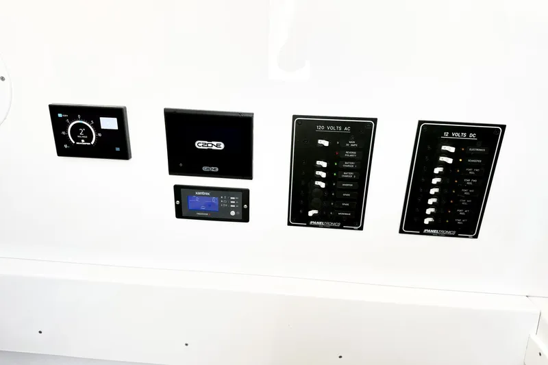 Slide: The Image of Control panel of a 2022 Onslow Bay 41 Tournament boat with various electronic displays. - 28