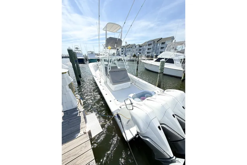 Slide: The Image of 2022 Onslow Bay 41 Tournament boat docked at marina with clear sky. - 3