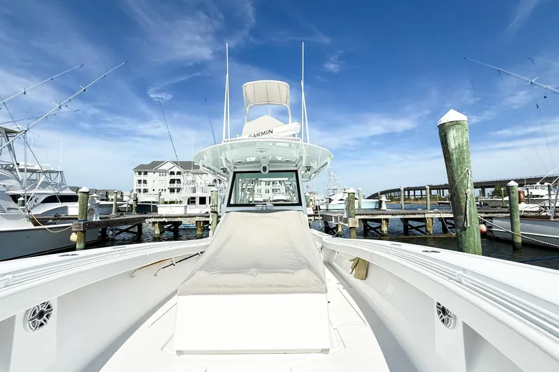 Slide: The Image of 2022 Onslow Bay 41 Tournament boat docked at marina under clear blue sky. - 32