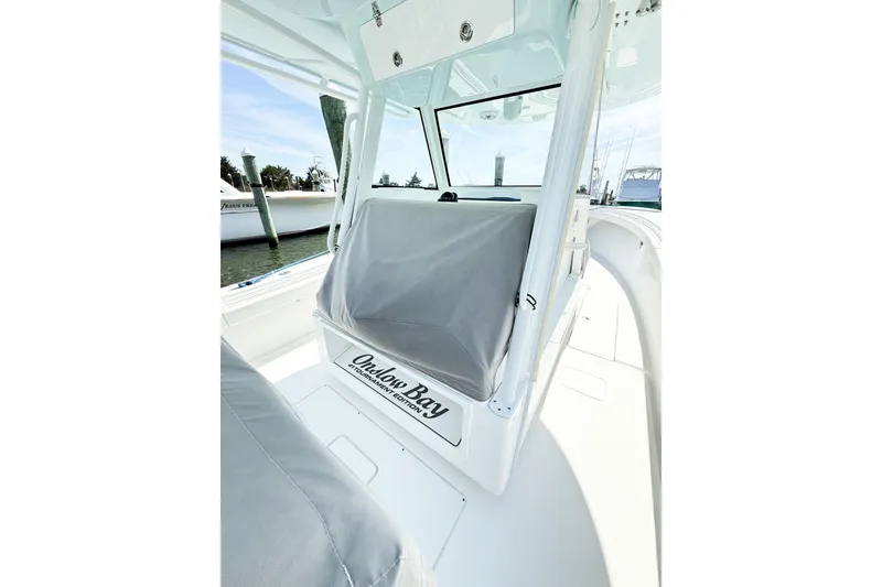 Slide: The Image of 2022 Onslow Bay 41 Tournament boat interior with covered seating and console. - 33