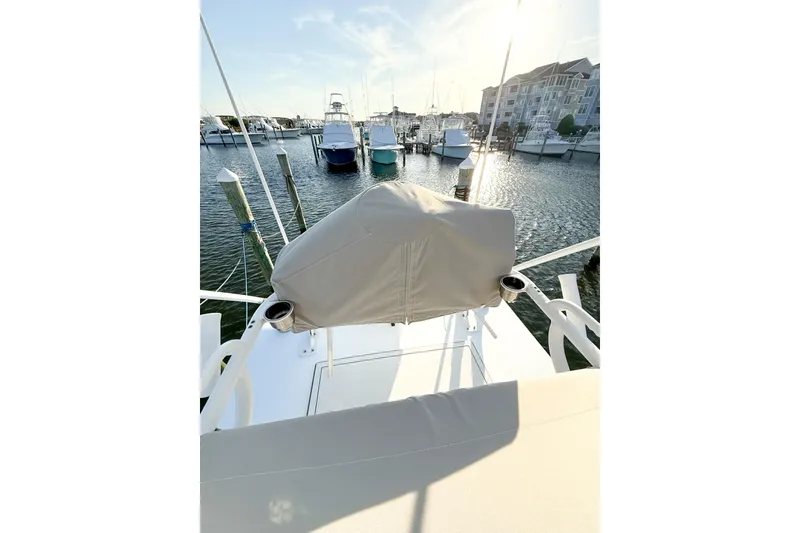 Slide: The Image of 2022 Onslow Bay 41 Tournament boat docked at marina, sunny day, covered helm. - 34