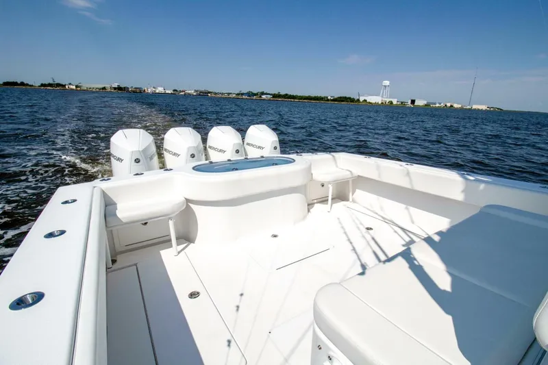 Slide: The Image of 2022 Onslow Bay 41 Tournament boat with four Mercury engines on open water. - 35