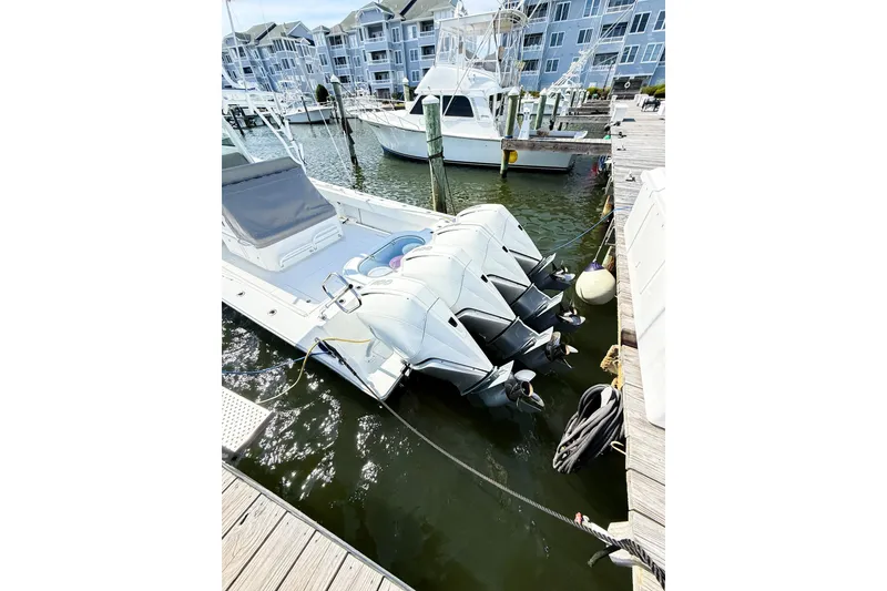 Slide: The Image of 2022 Onslow Bay 41 Tournament boat docked with triple outboard engines. - 4