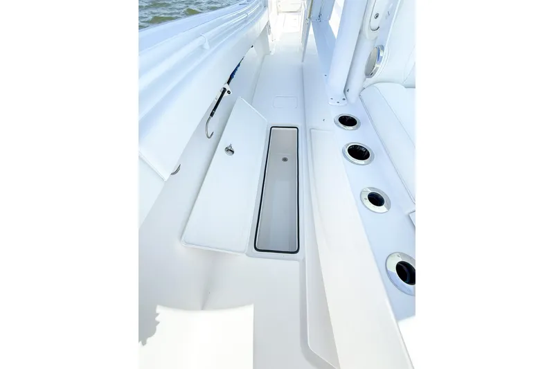 Slide: The Image of 2022 Onslow Bay 41 Tournament boat deck with storage compartment and cup holders. - 40