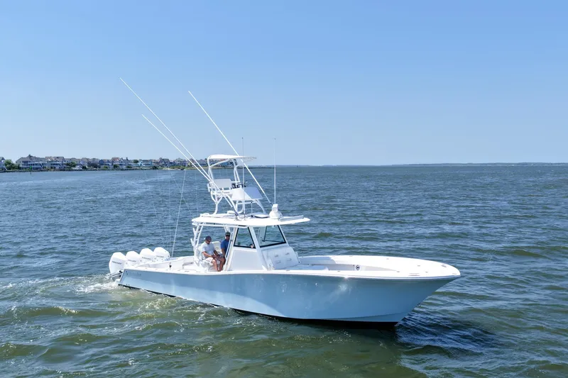 Slide: The Image of 2022 Onslow Bay 41 Tournament boat docked at marina under clear sky. - 42