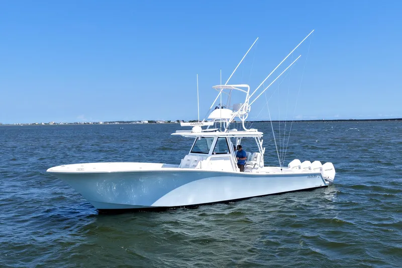 Slide: The Image of 2022 Onslow Bay 41 Tournament boat docked at marina under clear blue sky. - 44