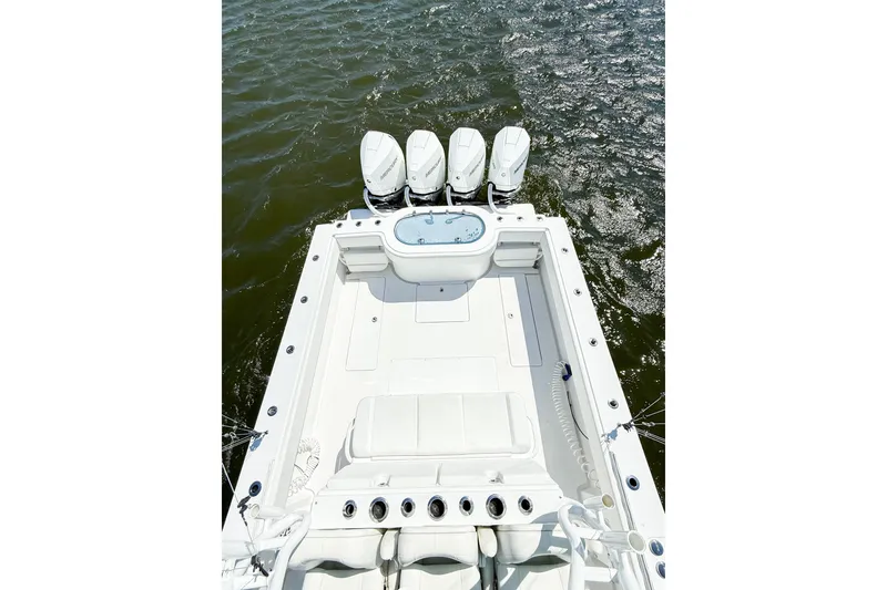 Slide: The Image of 2022 Onslow Bay 41 Tournament boat docked at marina under clear blue sky. - 46