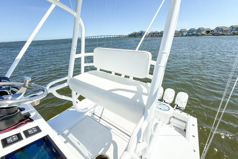 Slide: The Image of 2022 Onslow Bay 41 Tournament boat docked at marina under clear blue sky. - 48