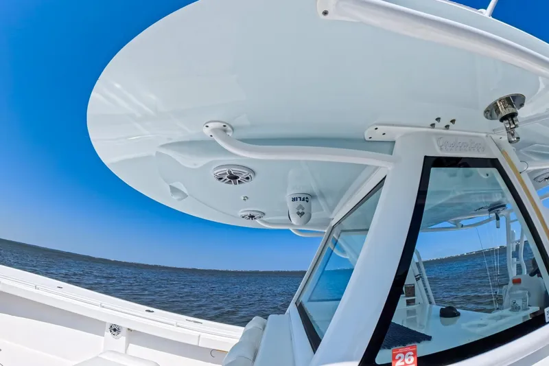 Slide: The Image of 2022 Onslow Bay 41 Tournament boat docked at marina, sunny day, covered helm. - 51