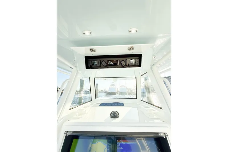 Slide: The Image of Interior view of 2022 Onslow Bay 41 Tournament boat cockpit with navigation equipment. - 7