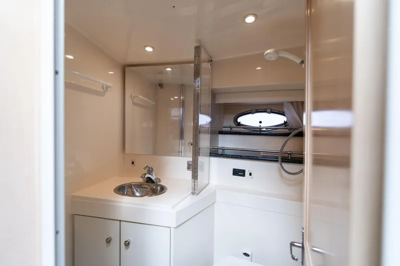 Slide: The Image of Luxurious bathroom in 2000 Carver 404 Cockpit Motor Yacht with modern fixtures. - 11