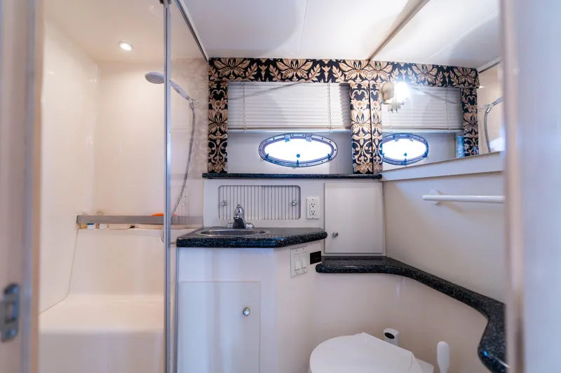 Slide: The Image of Luxurious bathroom in 2000 Carver 404 Cockpit Motor Yacht with elegant decor. - 19