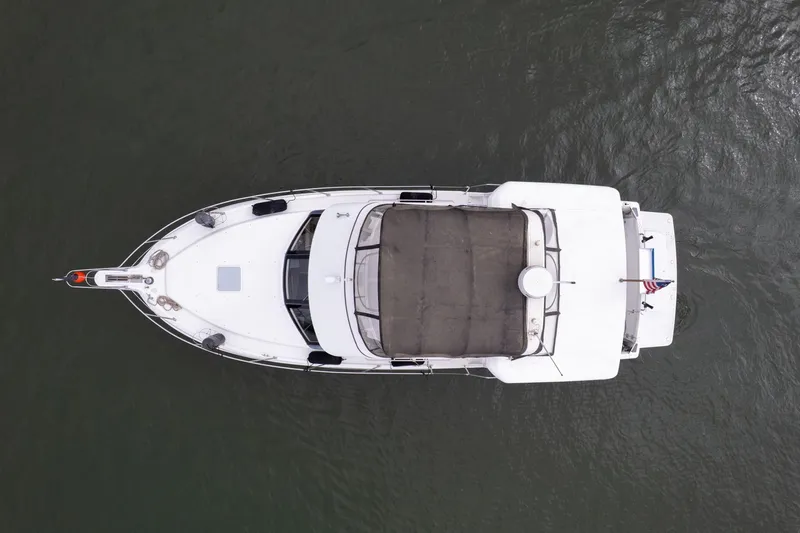 Slide: The Image of Top view of a 2000 Carver 404 Cockpit Motor Yacht on water. - 39