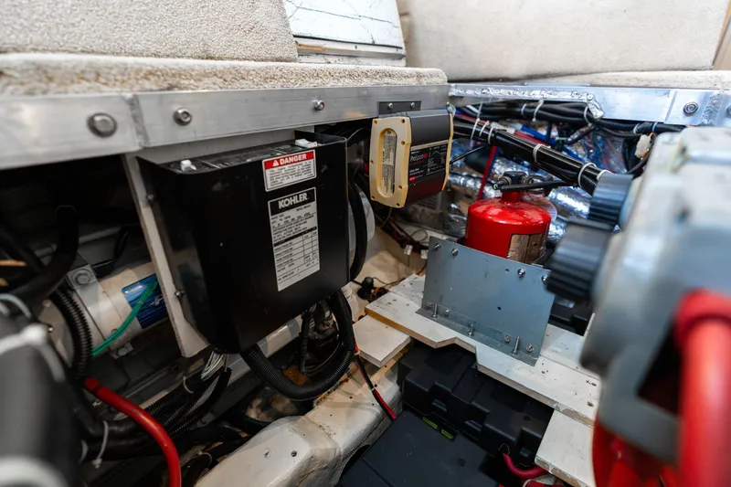 Slide: The Image of Engine room of a 2000 Carver 404 Cockpit Motor Yacht, featuring Kohler equipment. - 51