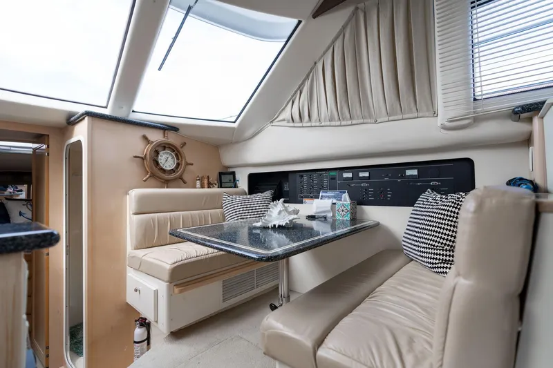 Slide: The Image of Interior of 2000 Carver 404 Cockpit Motor Yacht with seating and navigation controls. - 7