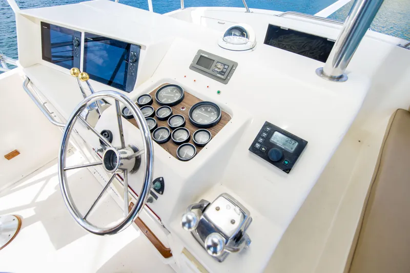 Slide: The Image of Helm of 1986 Ocean Yachts 48 Super Sport with gauges and steering wheel. - 12