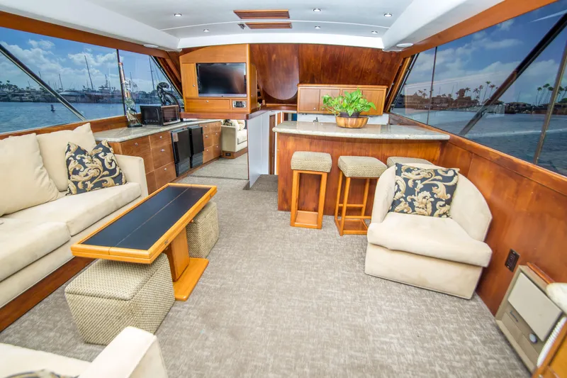 Slide: The Image of Luxurious interior of 1986 Ocean Yachts 48 Super Sport with elegant seating and panoramic windows. - 18