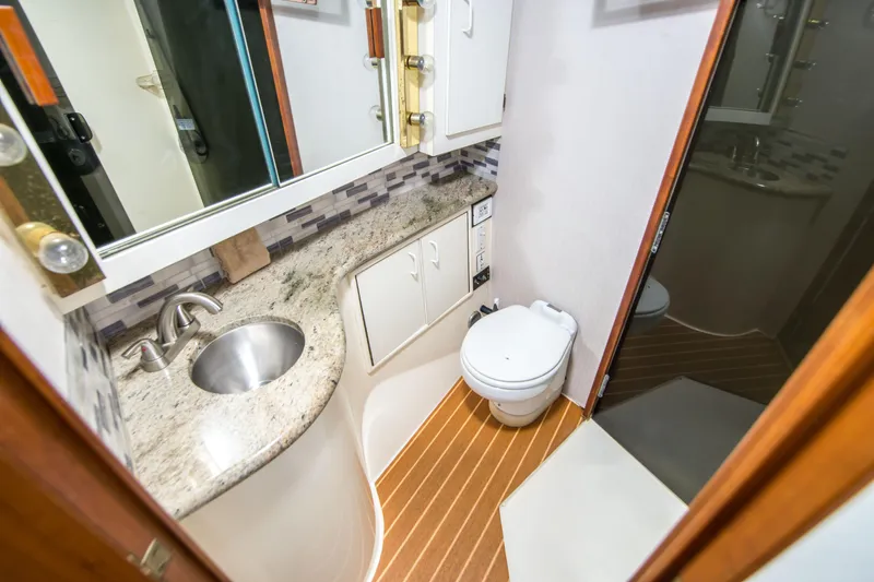 Slide: The Image of Bathroom interior of 1986 Ocean Yachts 48 Super Sport with sink and toilet. - 26