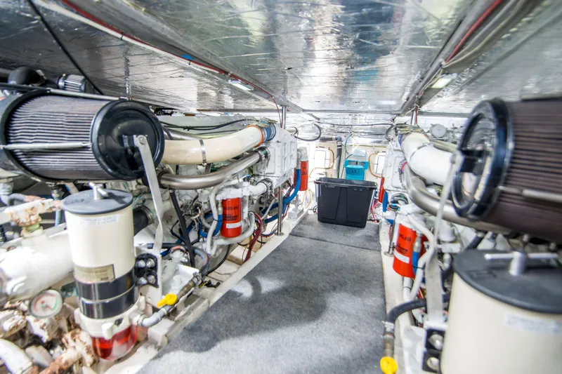 Slide: The Image of Engine room of 1986 Ocean Yachts 48 Super Sport, showcasing mechanical components and systems. - 30