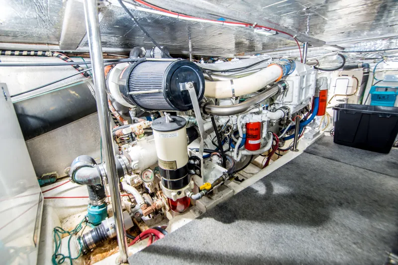 Slide: The Image of Engine room of 1986 Ocean Yachts 48 Super Sport, showcasing detailed mechanical components. - 31