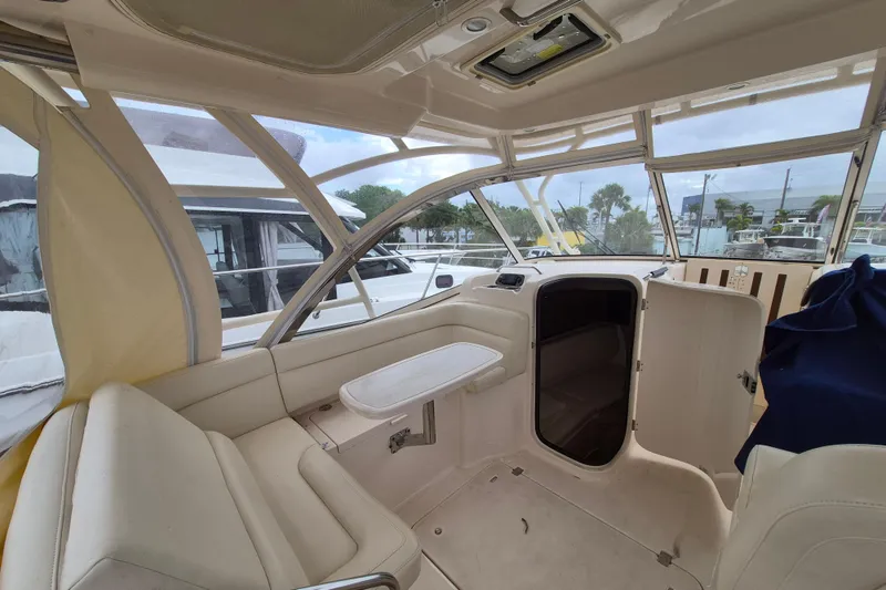 Slide: The Image of 2022 Grady-White Freedom 335 boat interior with seating and cabin entrance. - 5