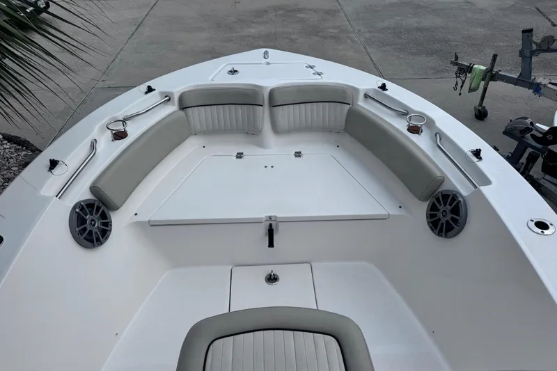 Slide: The Image of 2018 Sea Fox 206 Commander boat interior with cushioned seating and cup holders. - 14