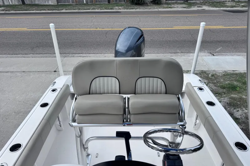 Slide: The Image of 2018 Sea Fox 206 Commander boat interior with seating and steering wheel. - 22