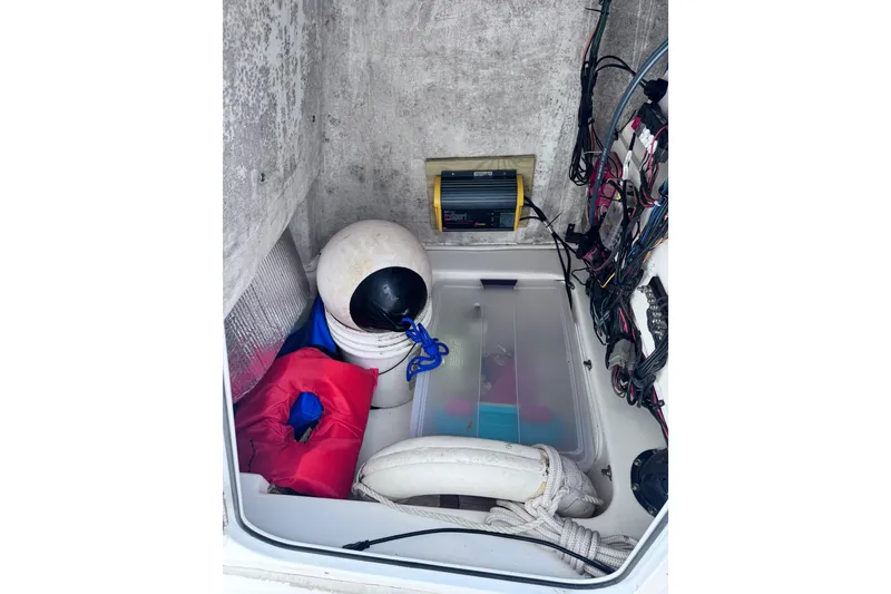 Slide: The Image of Storage compartment of a 2018 Sea Fox 206 Commander boat with safety equipment. - 25