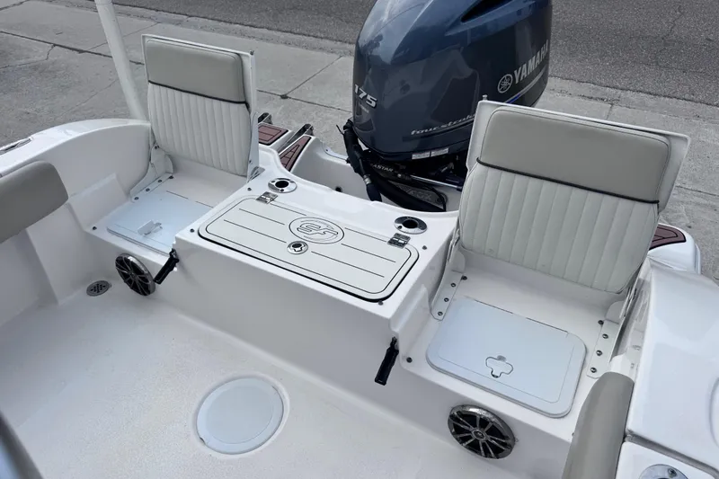 Slide: The Image of 2018 Sea Fox 206 Commander boat interior with Yamaha engine, featuring seating and storage compartments. - 27