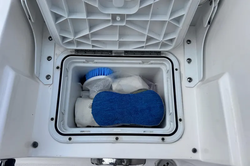 Slide: The Image of Storage compartment on 2018 Sea Fox 206 Commander boat with cleaning supplies. - 30