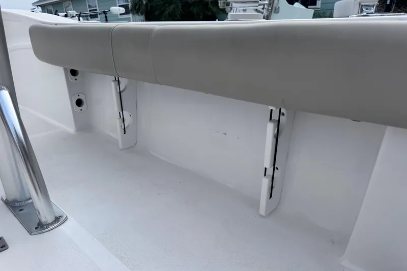 Slide: The Image of 2018 Sea Fox 206 Commander boat interior with cushioned seating and rod holders. - 33