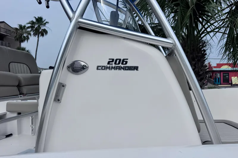 Slide: The Image of 2018 Sea Fox 206 Commander boat console with palm trees in the background. - 5
