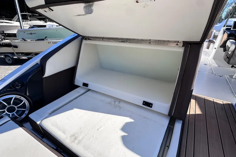 Slide: The Image of Open storage compartment on 2021 Yamaha Boats 252SD, showcasing spacious interior design. - 11
