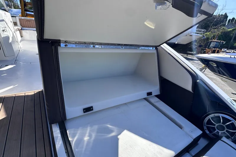 Slide: The Image of Open storage compartment on 2021 Yamaha Boats 252SD, showcasing spacious interior design. - 12