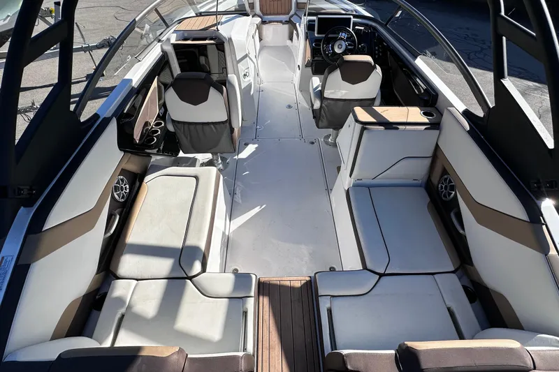 Slide: The Image of 2021 Yamaha Boats 252SD interior with spacious seating and modern helm design. - 13