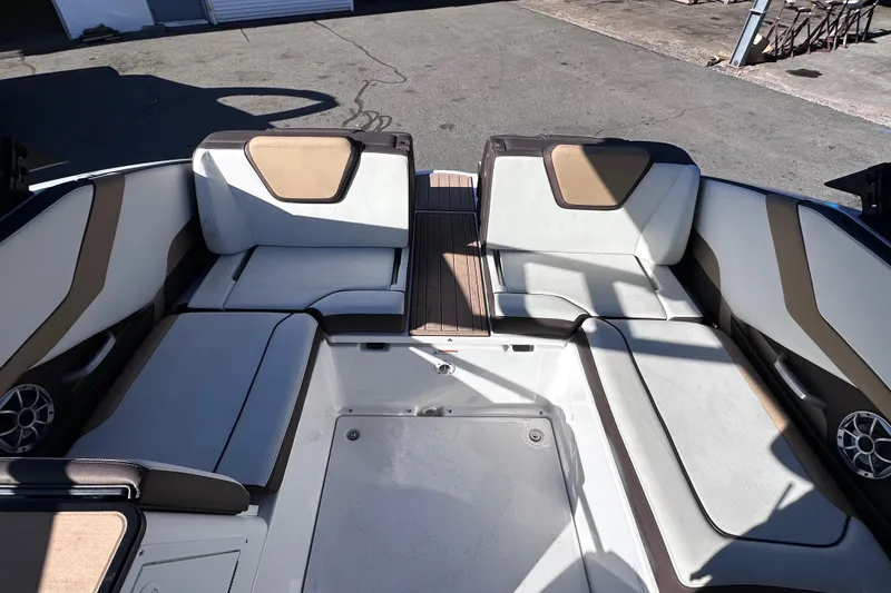 Slide: The Image of 2021 Yamaha Boats 252SD interior seating area with modern design and spacious layout. - 14