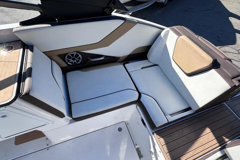 Slide: The Image of 2021 Yamaha Boats 252SD interior seating with modern design and integrated speaker system. - 18