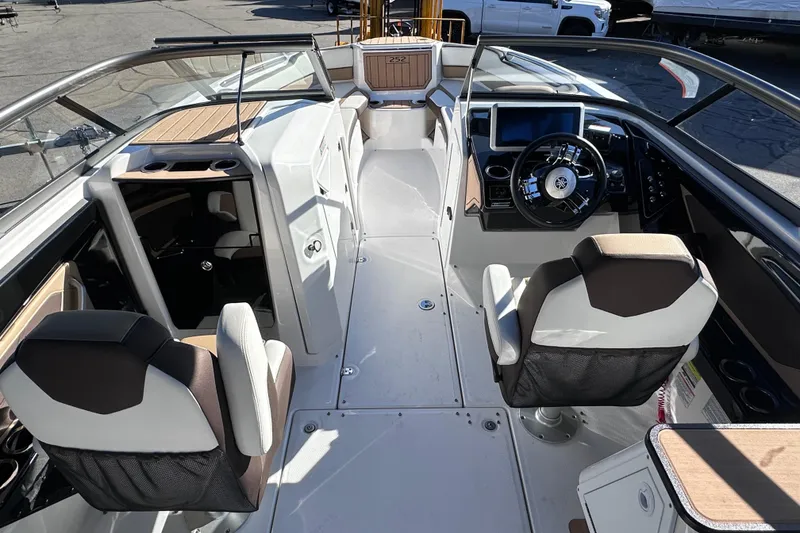 Slide: The Image of 2021 Yamaha Boats 252SD interior with modern helm, seating, and sleek design. - 24
