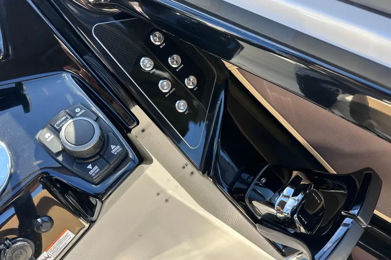 Slide: The Image of Control panel of 2021 Yamaha Boats 252SD, featuring sleek buttons and dials. - 28