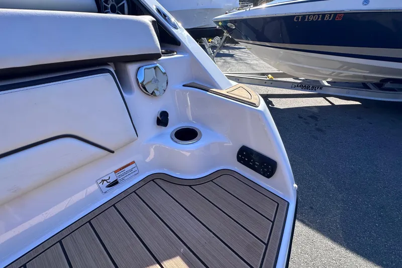 Slide: The Image of 2021 Yamaha Boats 252SD interior detail with seating and deck features. - 40